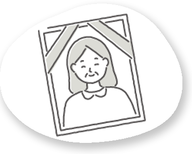 故人様の遺影写真を選定している様子